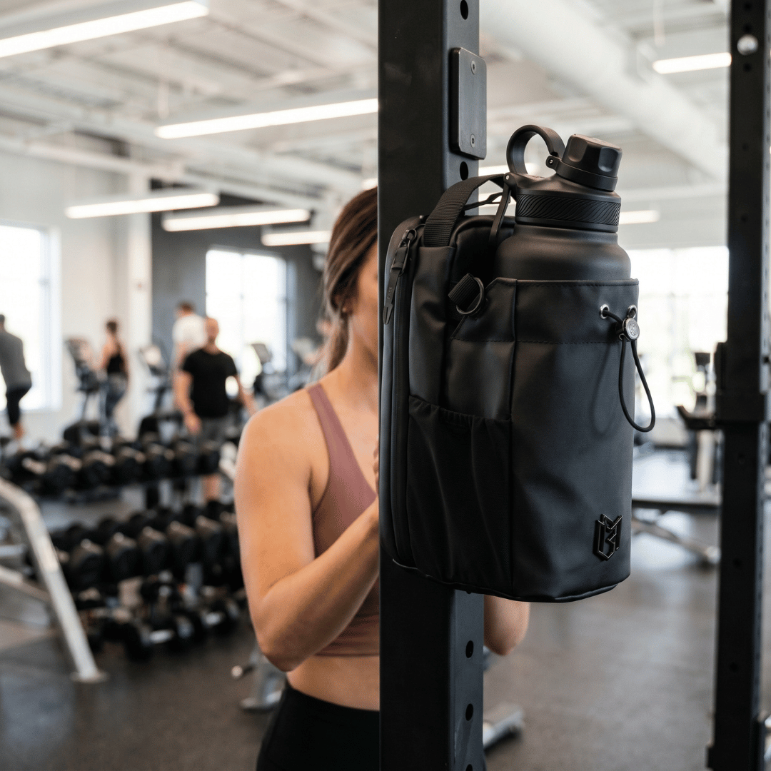 Black magnetic gym bag attached to a squat rack