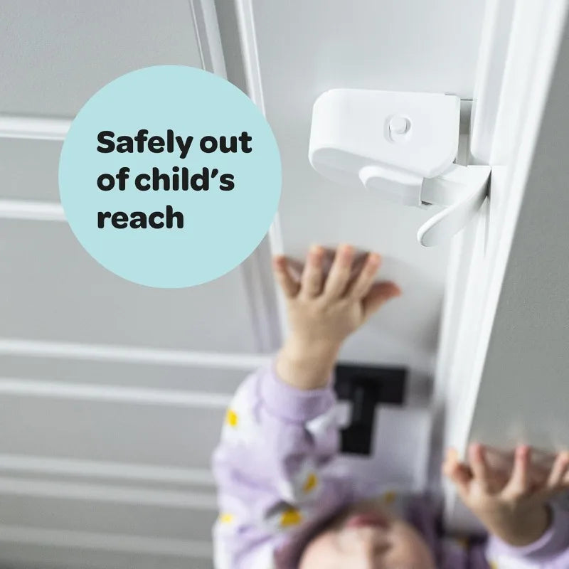 Toddler trying to open a door secured with a renter-friendly snap-on child safety lock.