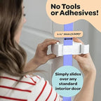 Toddler trying to open a door secured with a renter-friendly snap-on child safety lock.